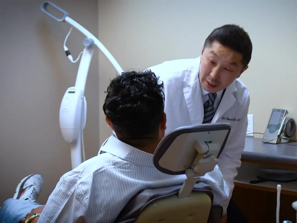 Dr. Lee with a patient in the dental chair