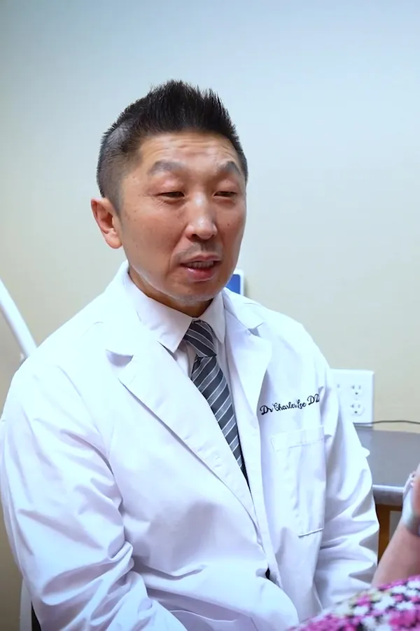 Dr. Charles Lee talks with a patient