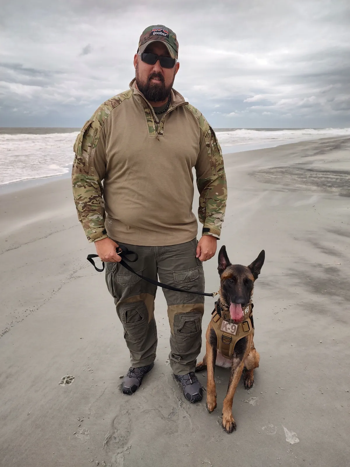 Handler and K9 on the beach