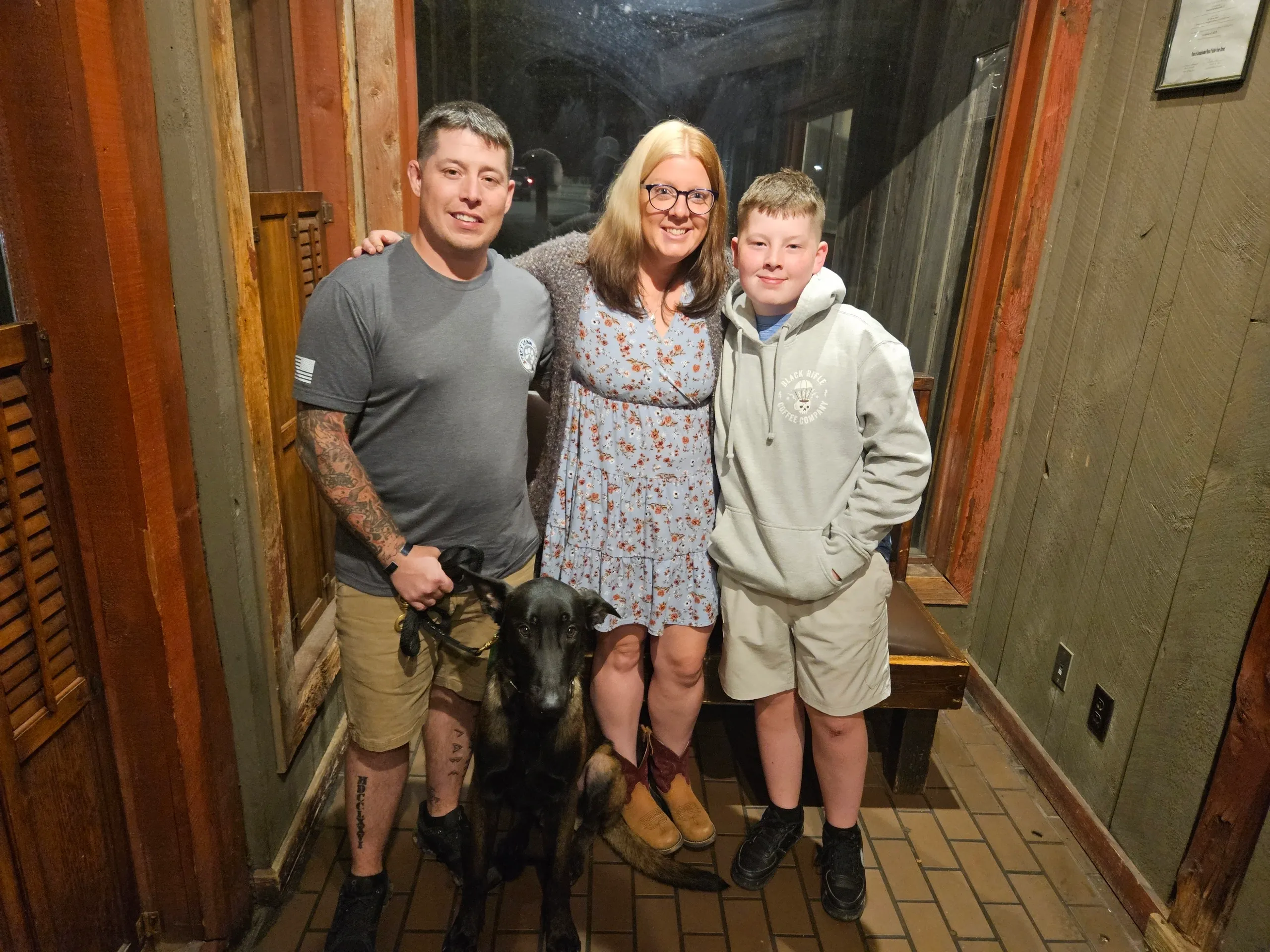 A recipient family with their dog