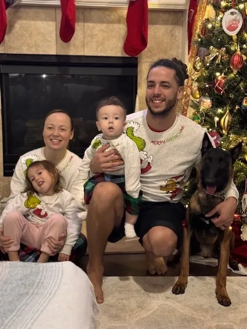 A service dog at home with its family