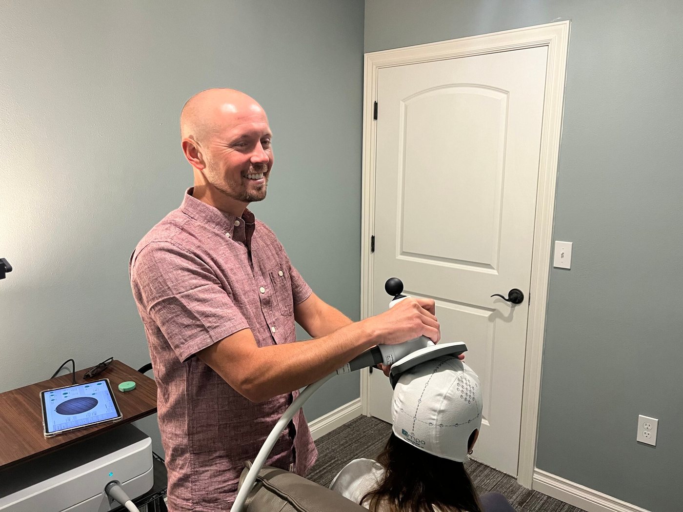 Thomas Tervort, DNP, during a TMS session
