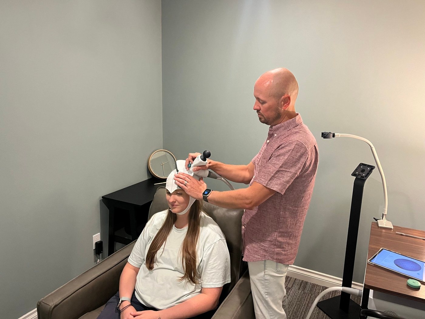 A patient in the treatment chair with Thomas Tervort, DNP